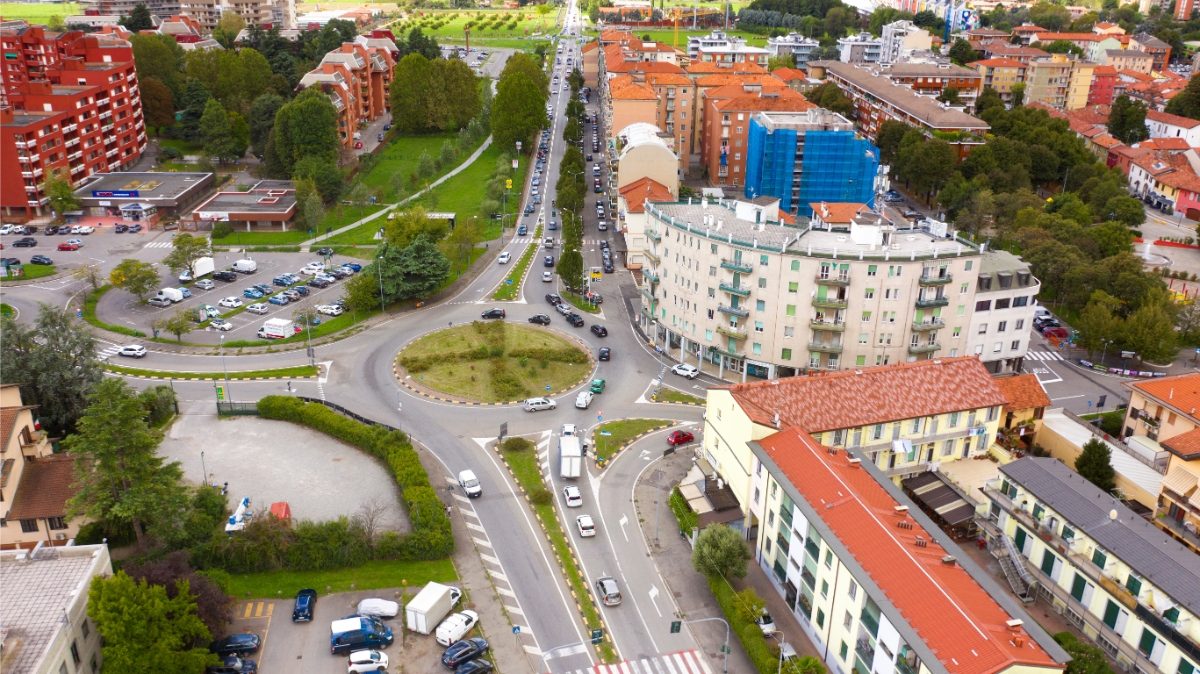 Aerial view of vehicles and traffic on a roundabout in Vimodrone, Milan, Italy