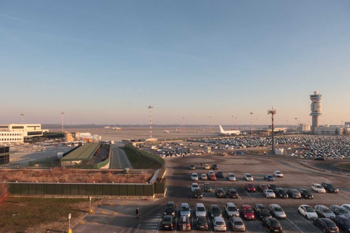 Parking and the runway of the Milan Malpensa Airport or the Milano Malpensa Airport in Milan, Italy