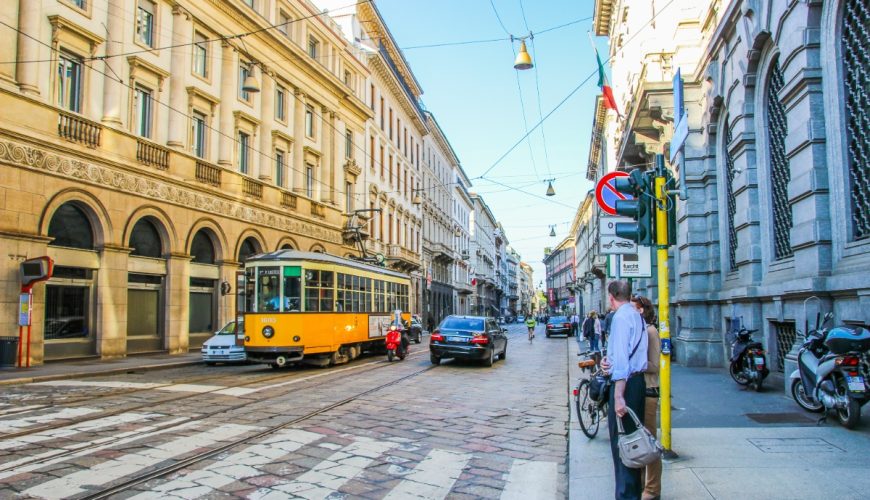 Tram and traffic on a busy street in Milan, Italy