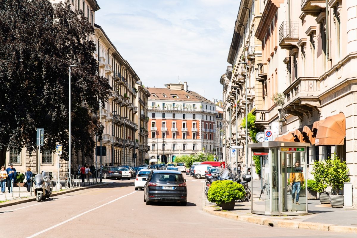 Cars driving at the Via Caradosso Street  in Milan, Italy