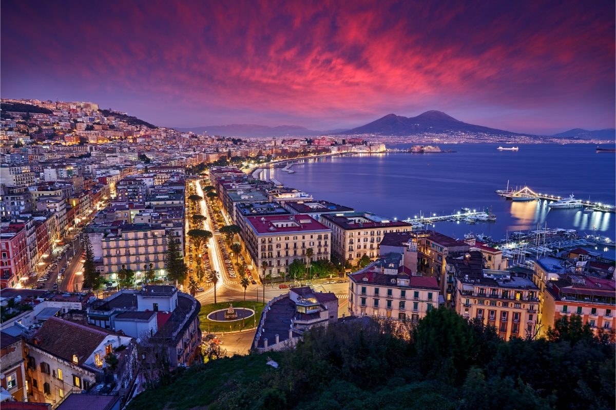 Naples, Italy cityscape with an aerial view at night and sparkling lights