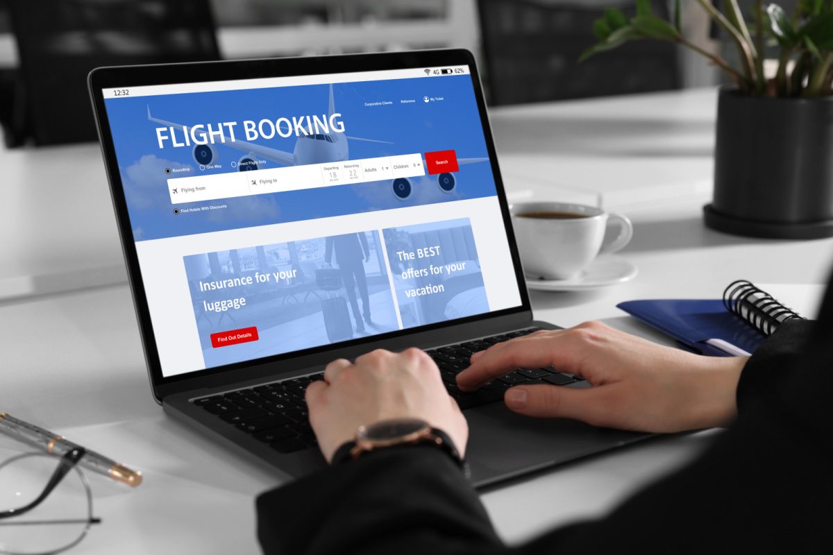 Woman using laptop to booking a flight online