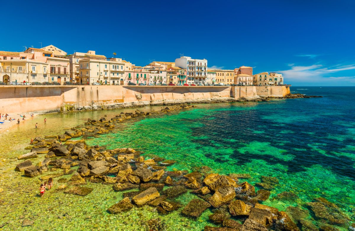 Ortygia cityscape by the ocean and skyline on Sicily, Italy