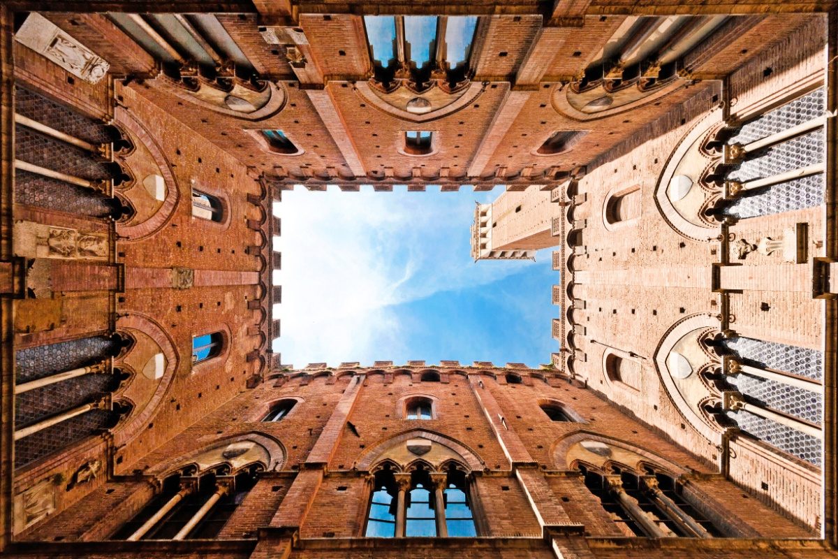 View of Palazzo Pubblico stunning medieval architecture in Siena, Italy