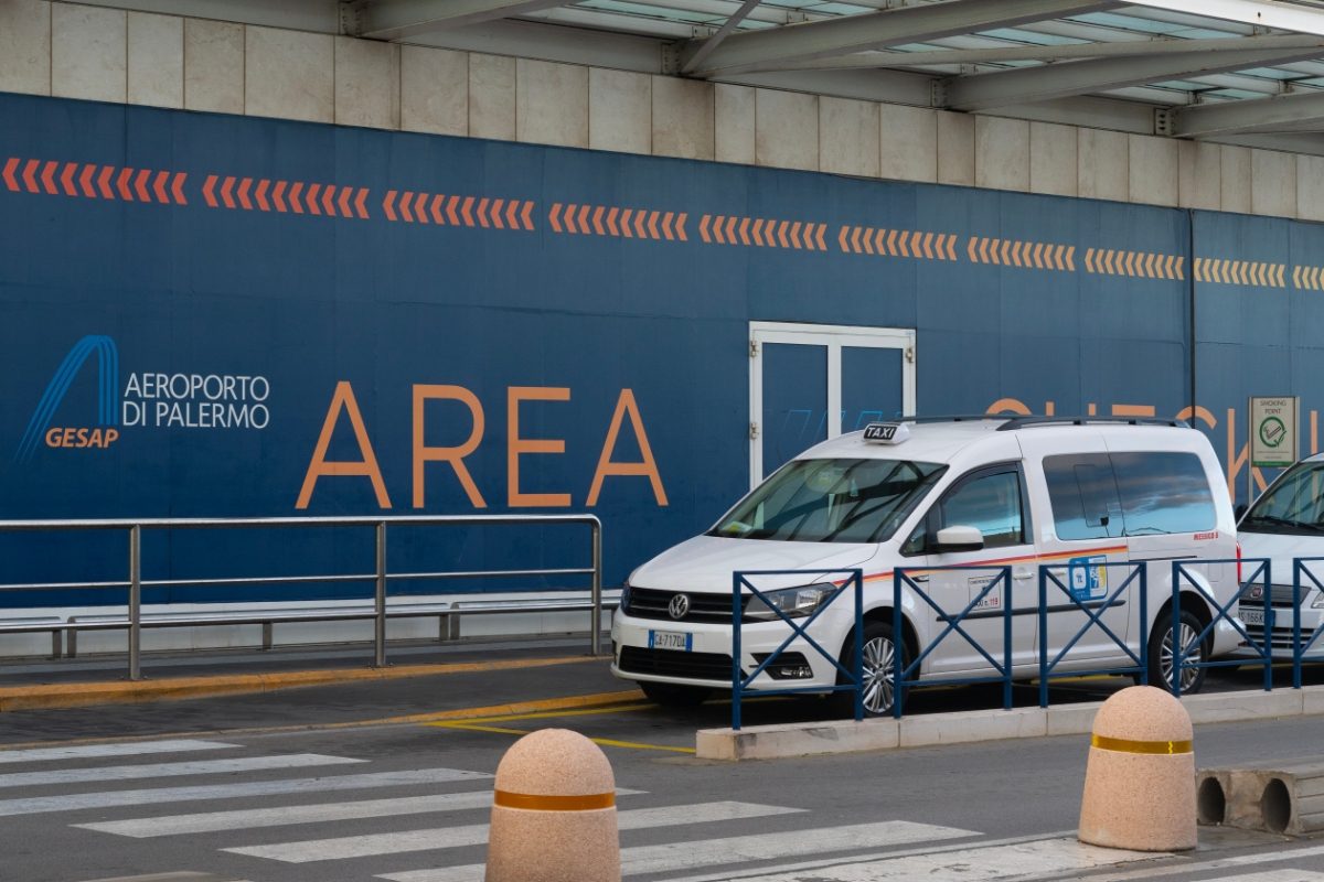 Taxi parked and waiting in front of Palermo airport in Palermo, Italy