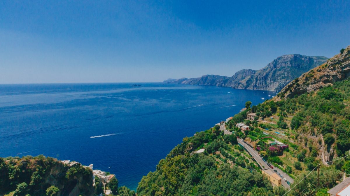 Aerial view of the ocean and coastline of Amalfi Coast from Path of the Gods hiking trail in Positano, Italy