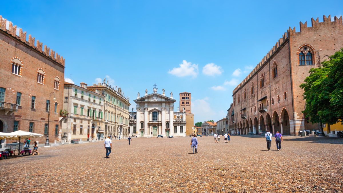 People strolling the Piazza delle Erbe, Mantua, Italy 