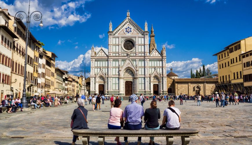 Tourists and locals exploring the Piazza di Santa Croce in Florence, Italy