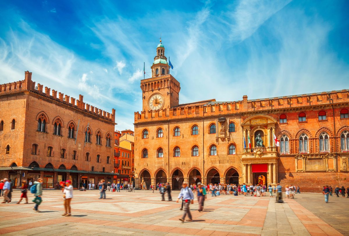 Crowd exploring Piazza Maggiore in Bologna, Italy