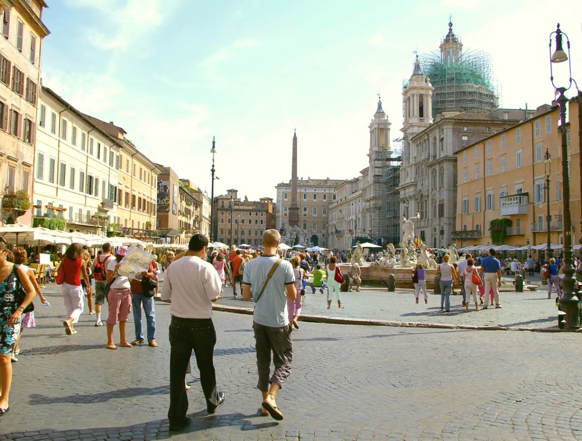 Locals and tourists exploring the Piazza Navona in Rome, Italy