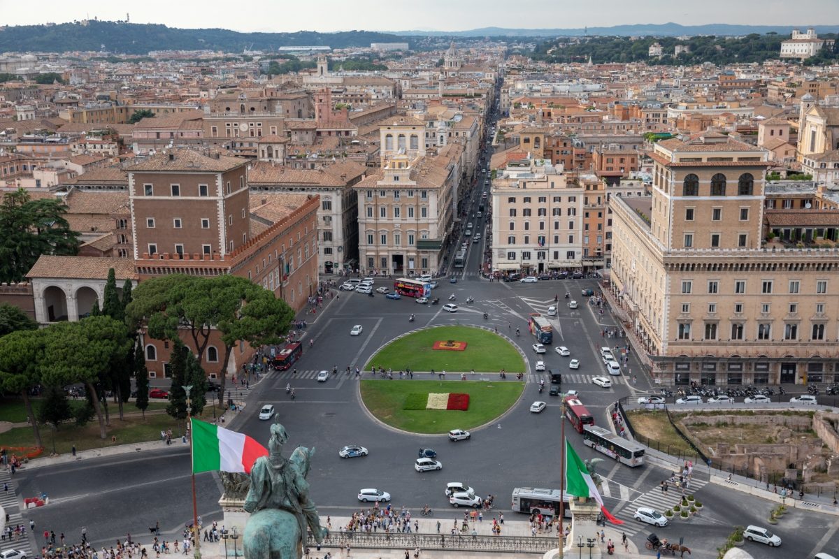 Aerial view of Piazza Venezia cars and different vehicles in Rome, Italy