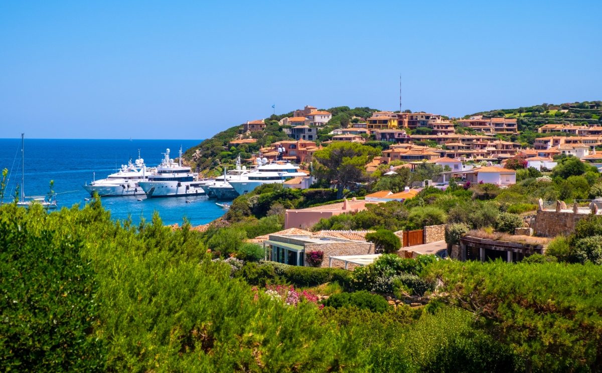 Panoramic view of luxury yacht port and Porto Cervo cityscape in Sardinia, Italy