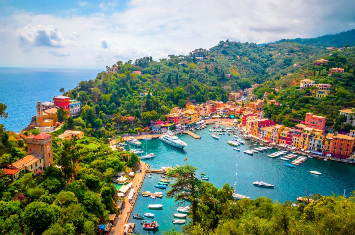 Aerial view of the Portofino Comune colorful houses and boats in Liguria, Italy