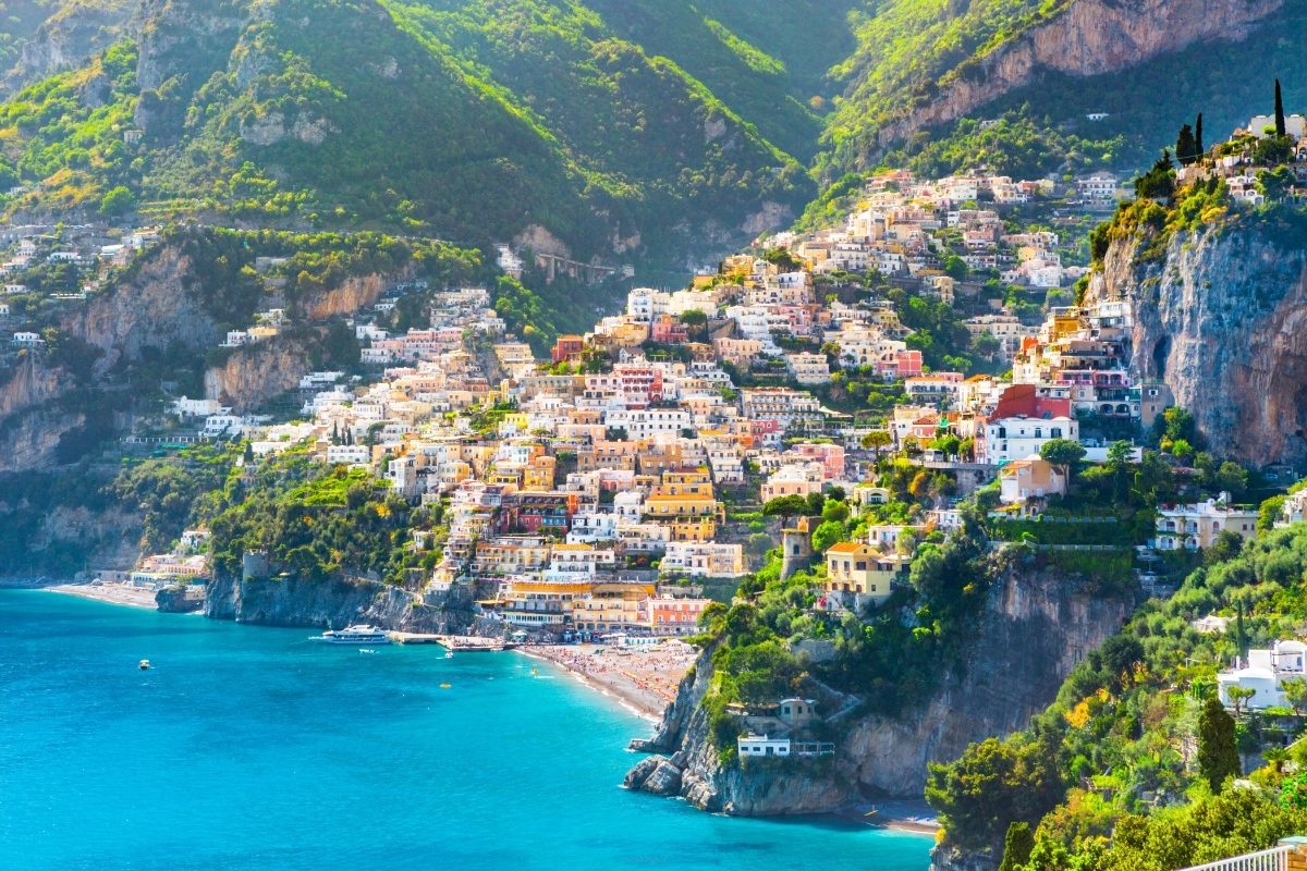 Panoramic view of Positano cityscape, showcasing its colorful buildings along the Mediterranean coastline in Italy