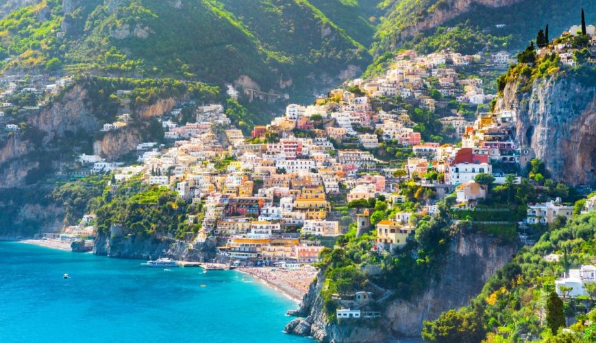 Panoramic view of Positano cityscape, showcasing its colorful buildings along the Mediterranean coastline in Italy