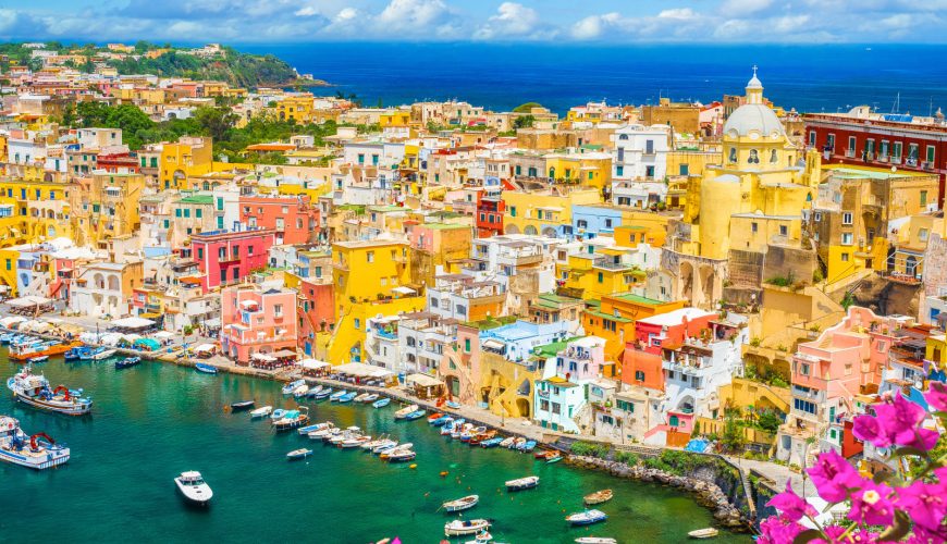 Aerial view of the colorful houses and port on Procida Island, Italy