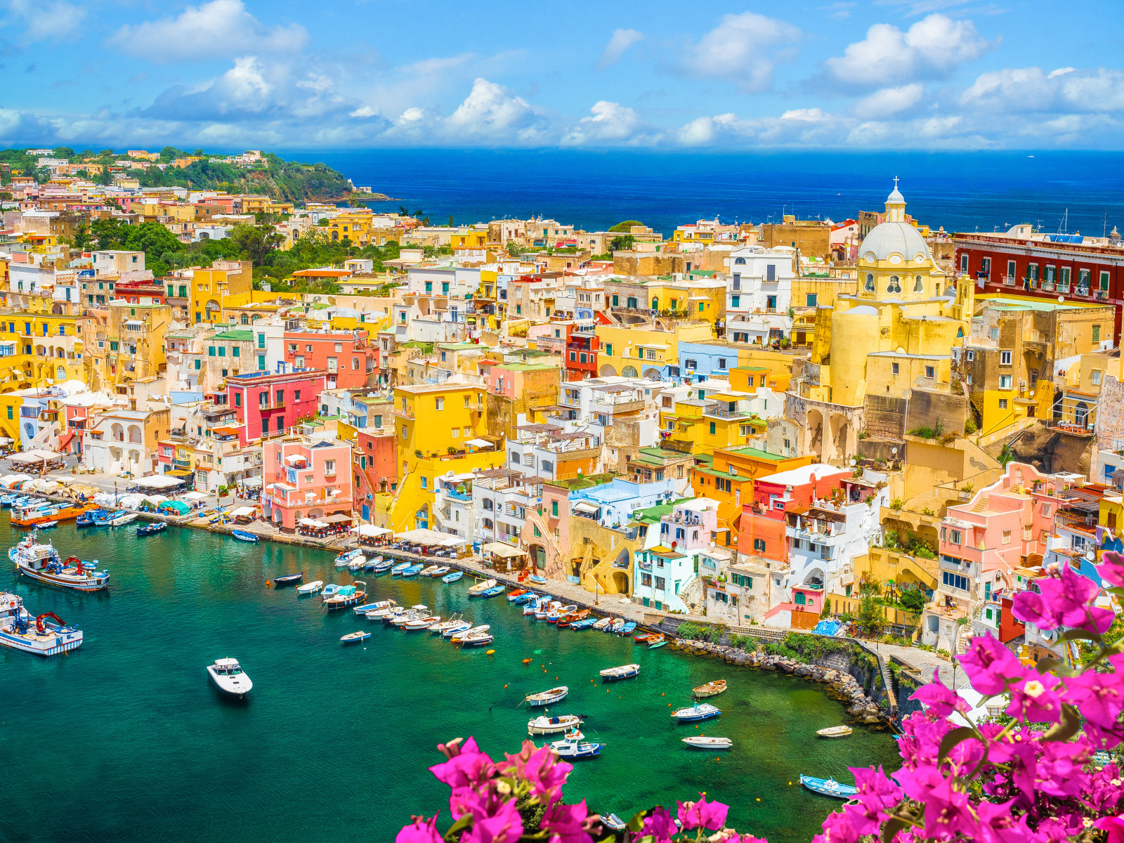 Aerial view of the colorful houses and port on Procida Island, Italy