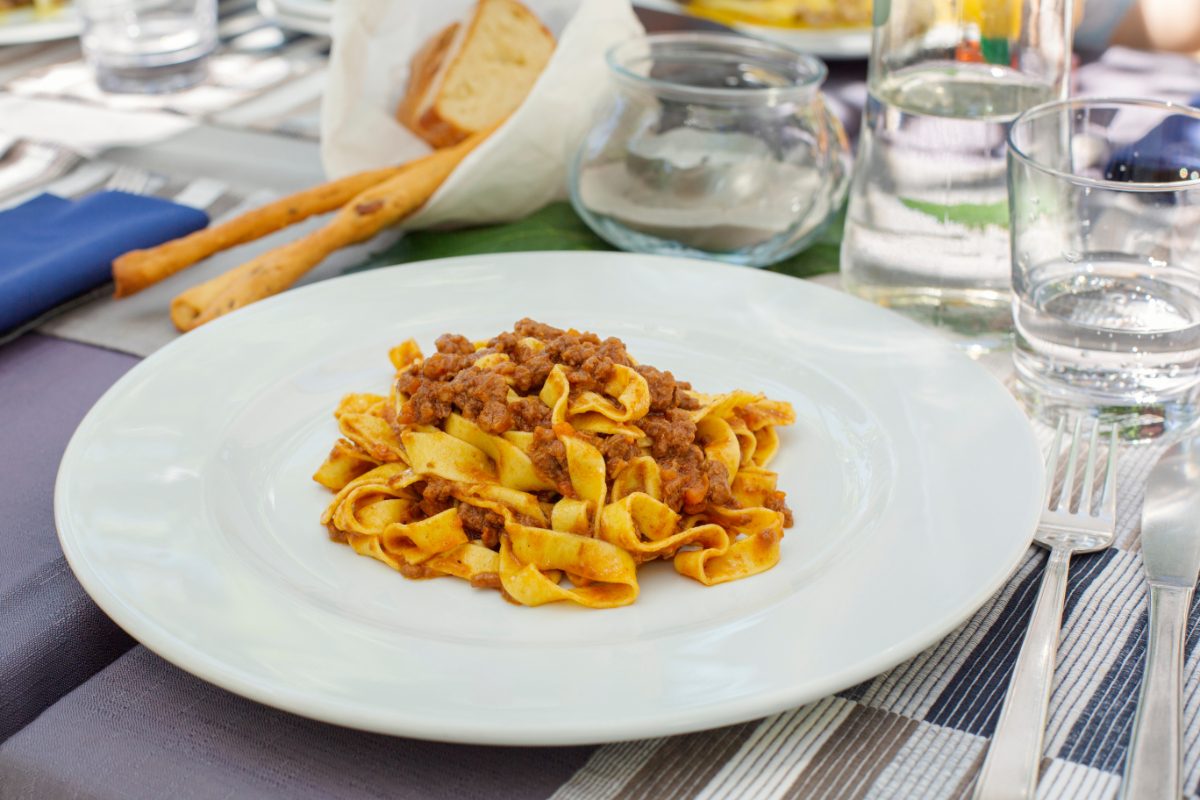 Close-up of a ragù alla Bolognese served on a white plate