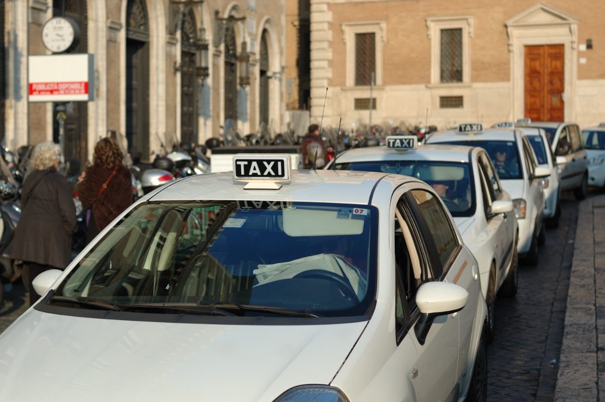 Row of parked taxi in Rome, Italy