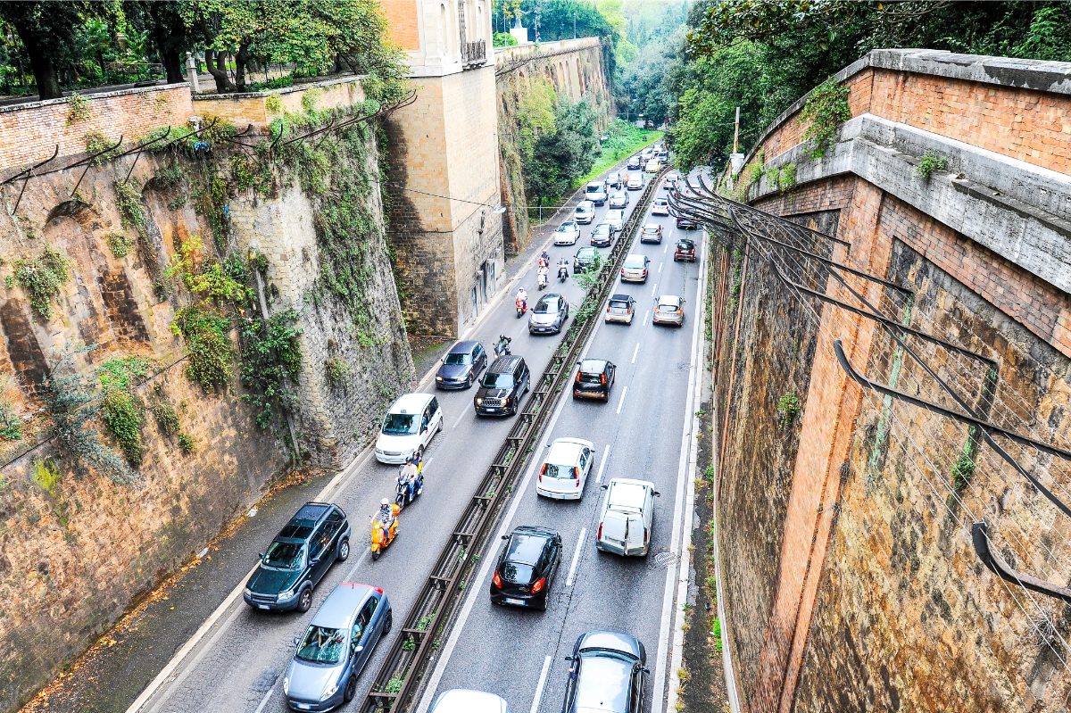 Top view of a busy street with different vehicles in Rome, Italy