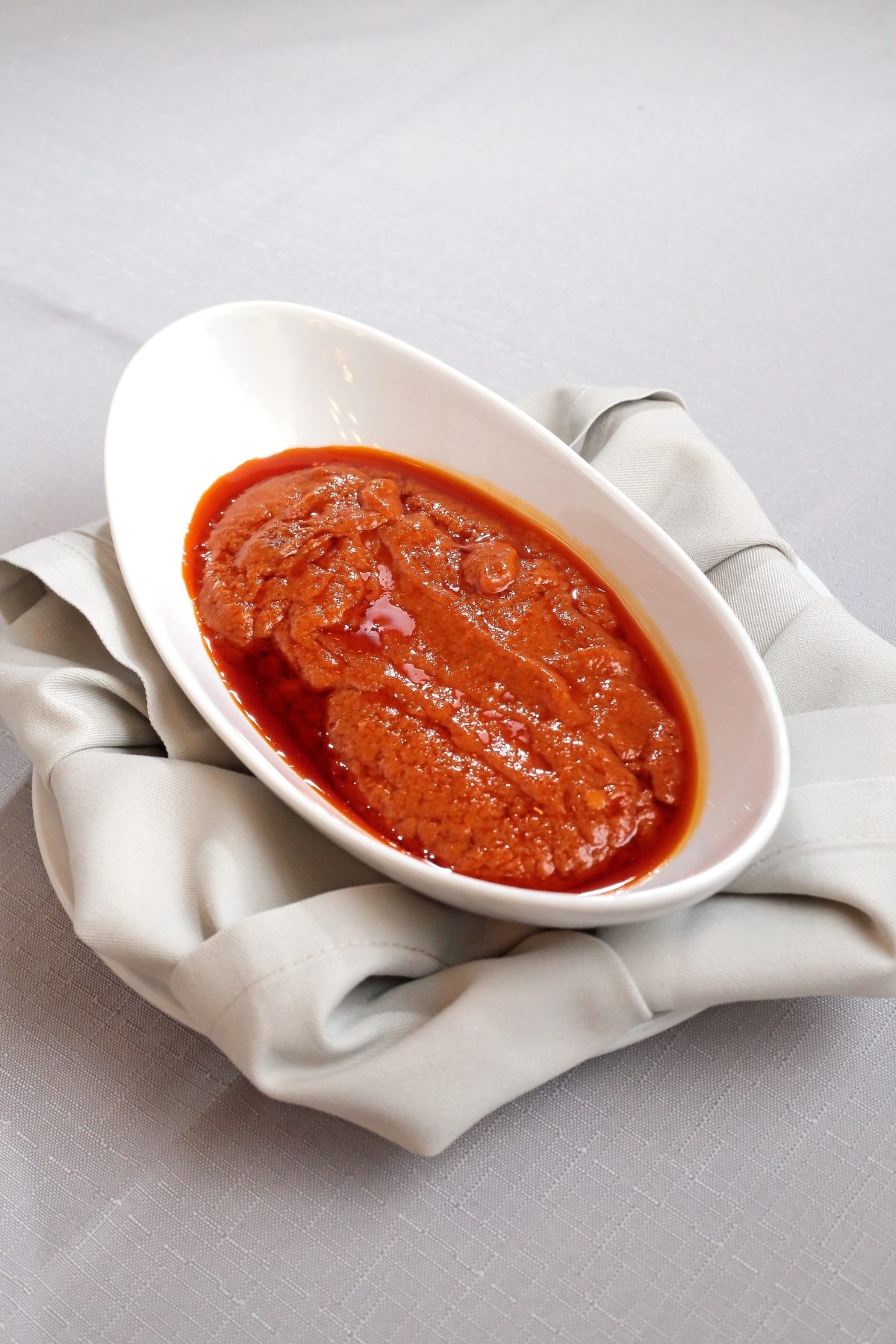 Close of a Italian Sardella Fish Paste served on a white bowl