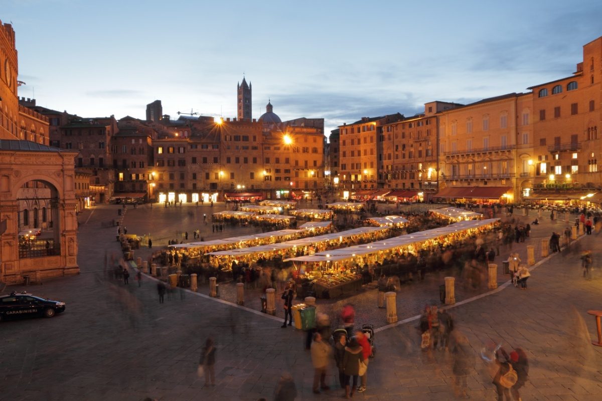 Panoramic view of the traditional Christmas markets in Siena, Italy with festive stalls 