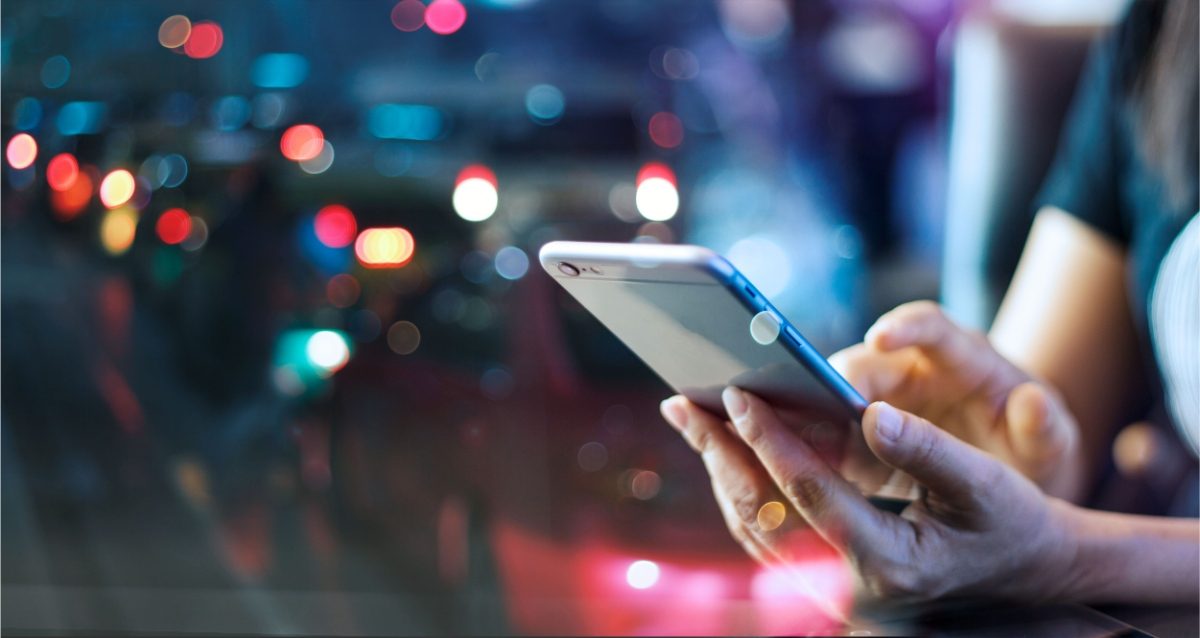 Woman using and holding a mobile smart phone