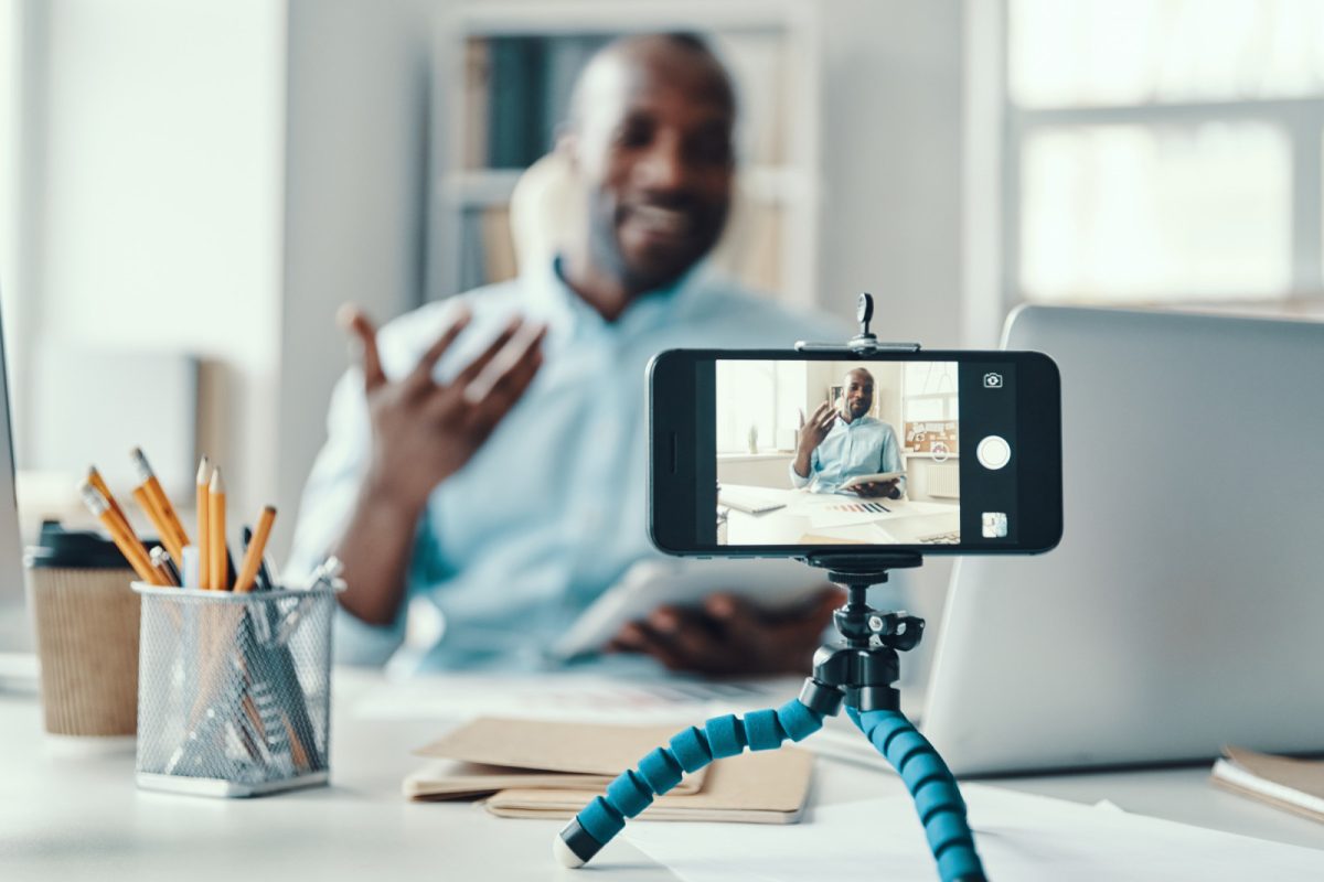 Male social media influencer recording a video 