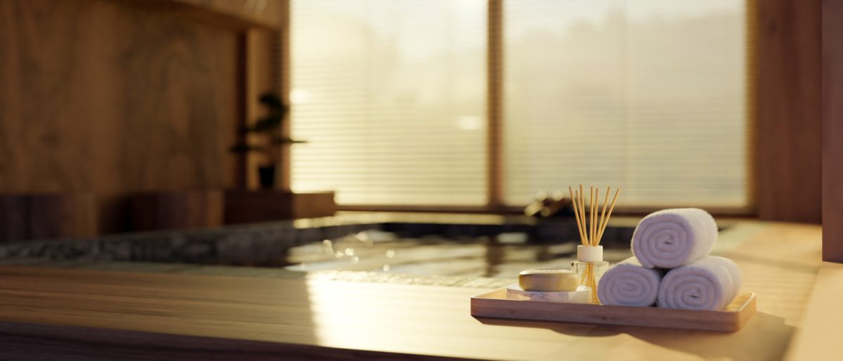 Spa accessories and towels on a spa bath