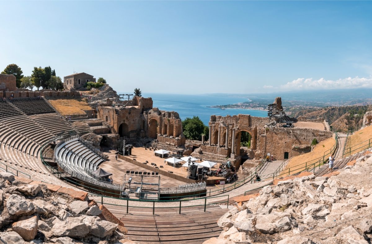 Panoramic view Teatro Antico di Taormina old ruins in Taormina, Italy