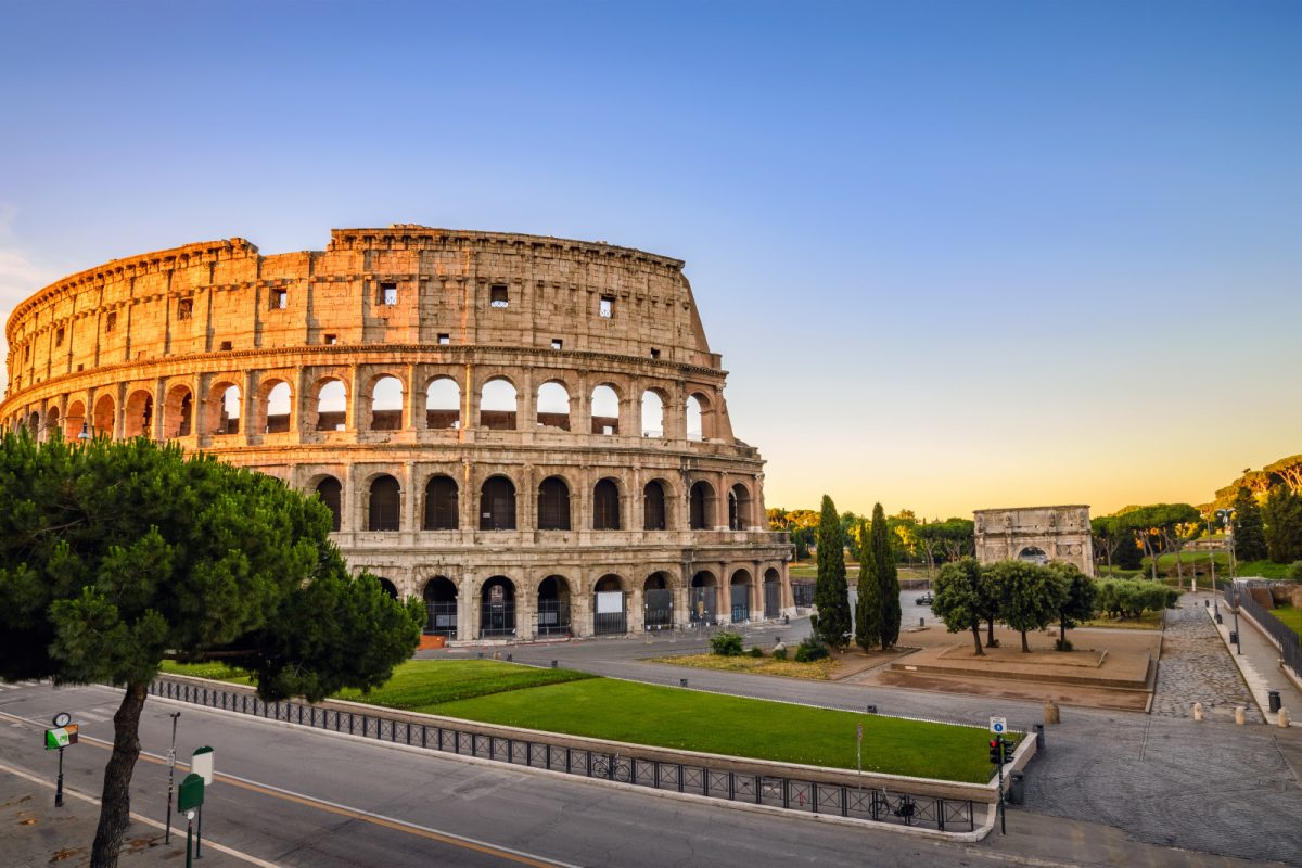 Panoramic view of the Colosseum's architecture at sunset in Rome, Italy