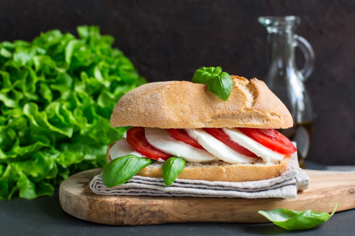 Close-up of the delicious Panino Caprese sandwich with mozzarella, tomatoes, and basil