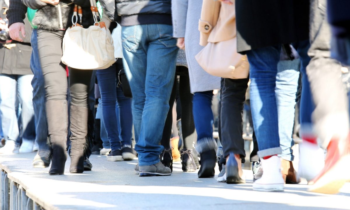 Tourists in Venice wearing different walking shoes