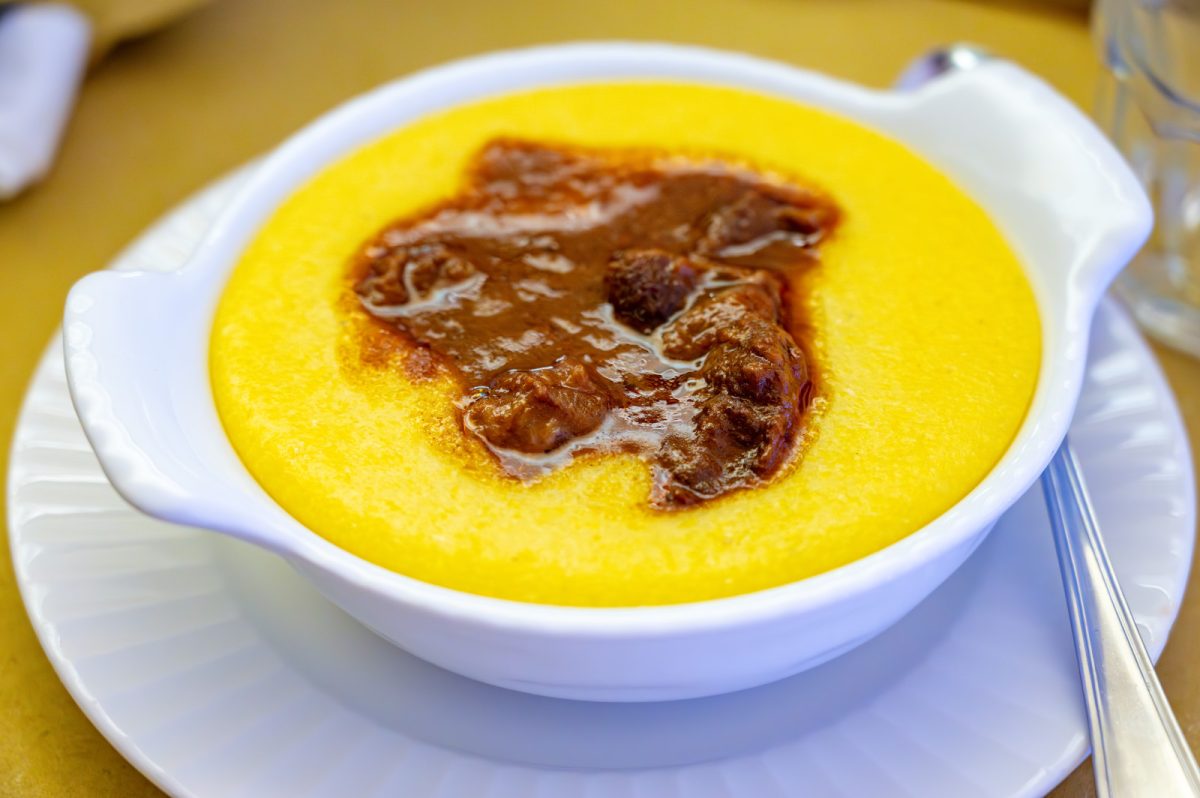 Close-up of traditional Italian polenta corn porridge on a bowl served in Italy