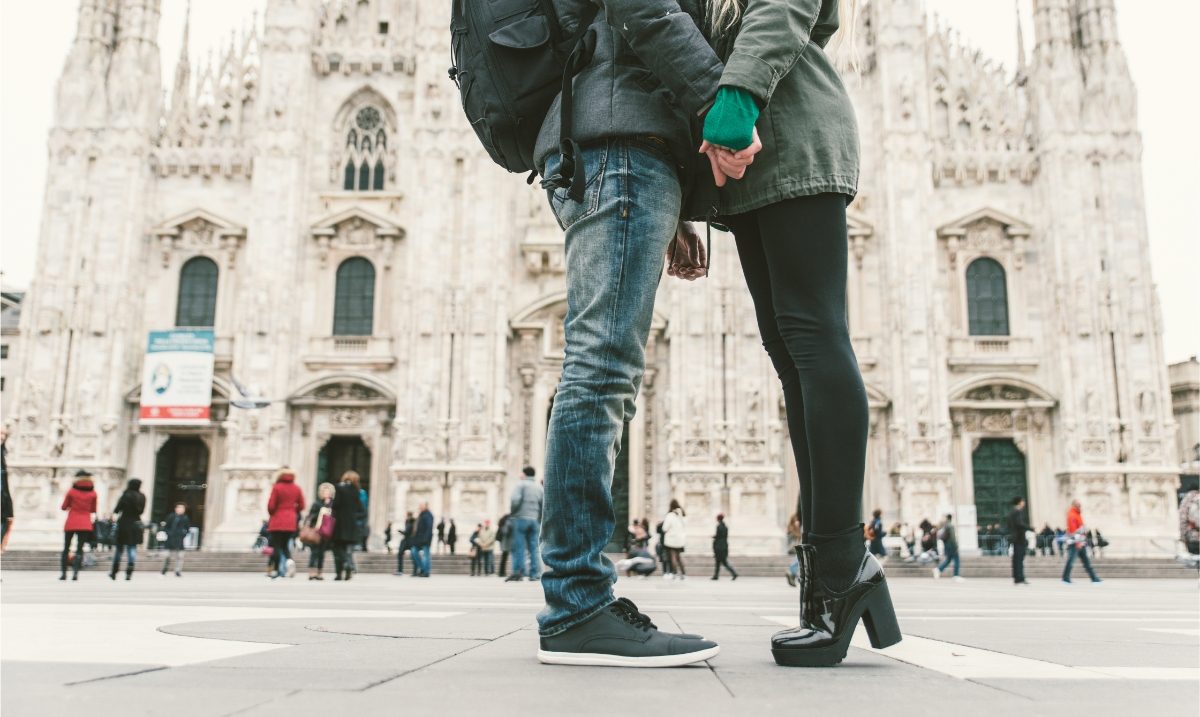 Couple wearing different footwears while in Milan, Italy