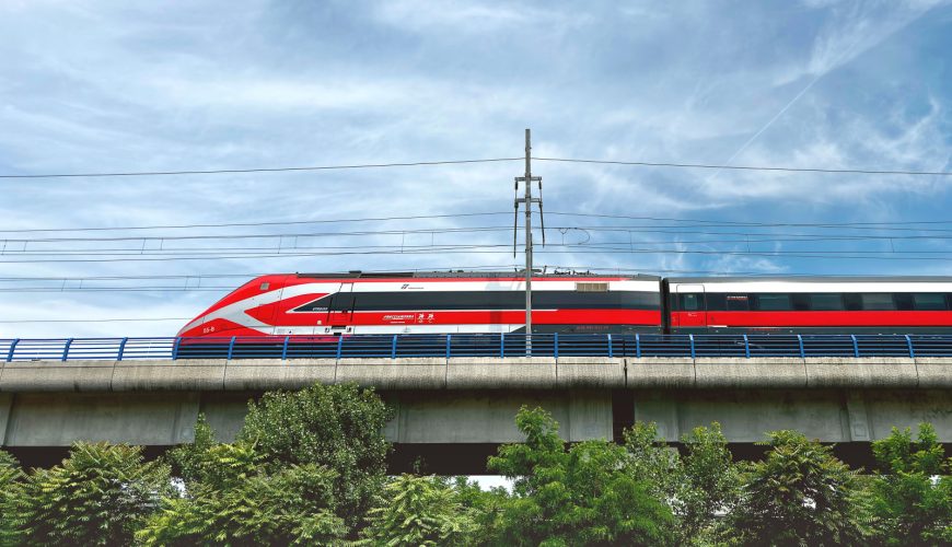 Trenitalia speed train passing on the bridge in Italy