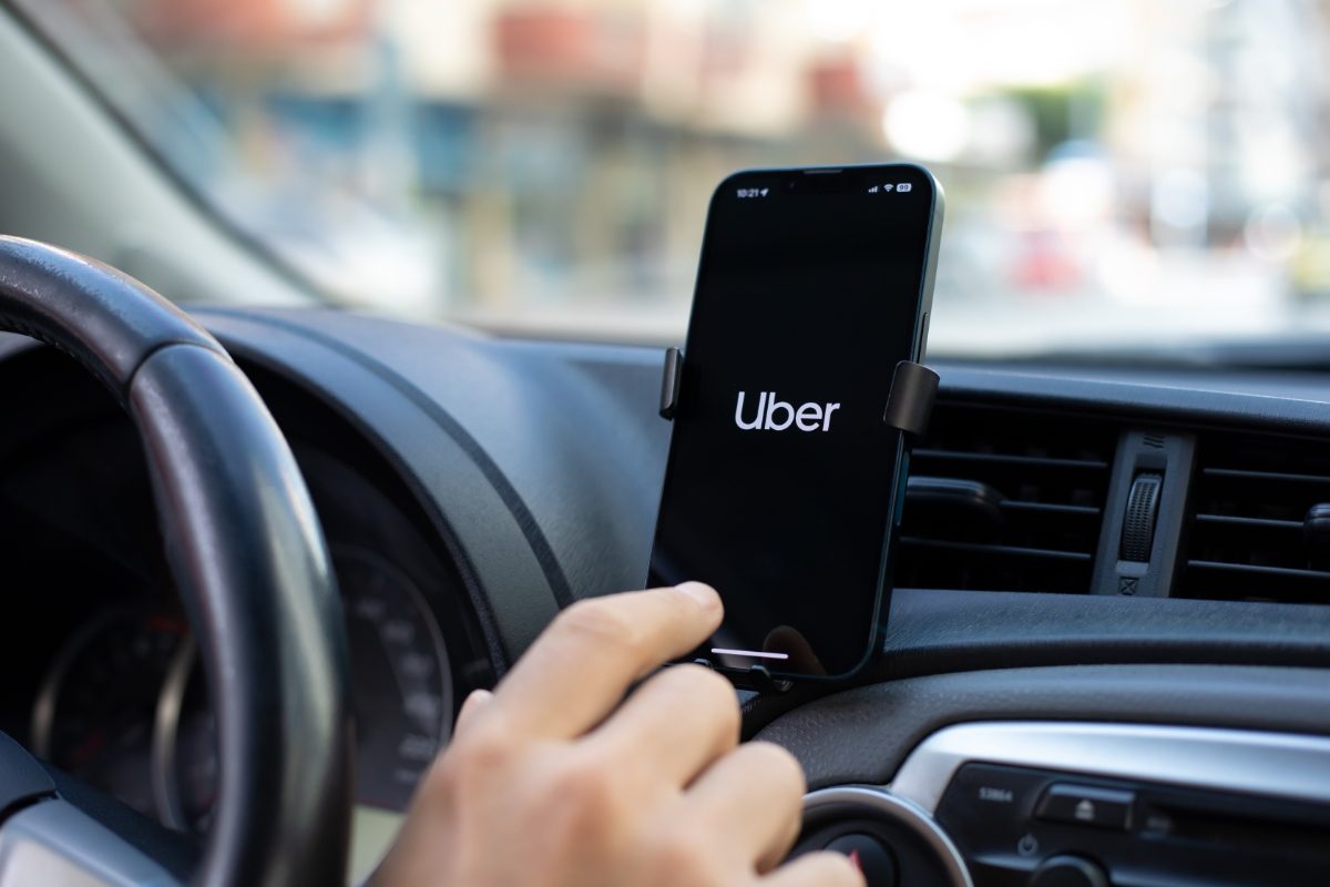 Phone displaying the Uber ride-sharing app logo