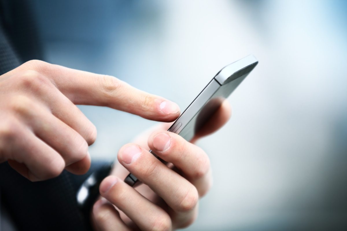 Close up of a man using a smartphone