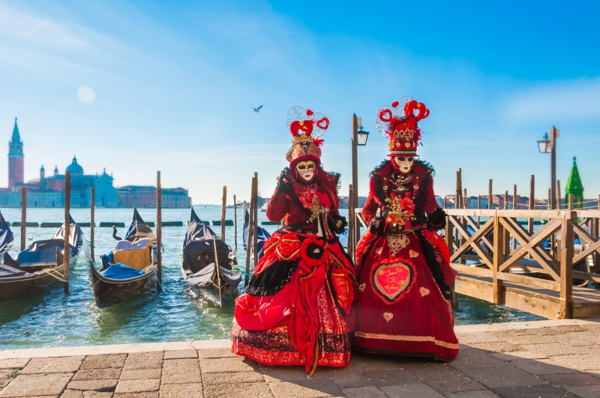 Two people wearing venetian carnival mask for Venice Carnival in Venice, Italy