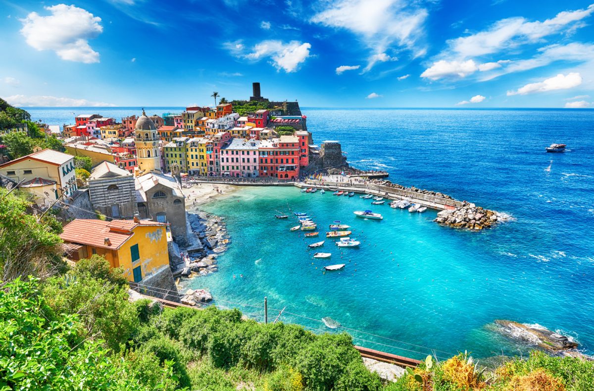 Panoramic view of colorful houses by the coast and ocean view in Vernazza, Cinque Terre, Italy