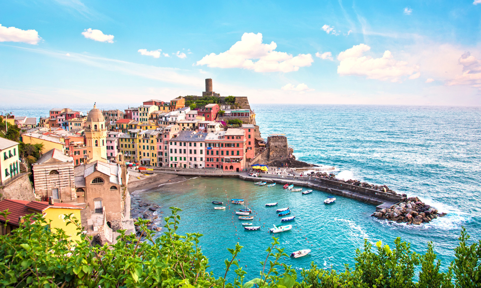 Panoramic view of colorful houses by the coast in Vernazza, Cinque Terre, Italy