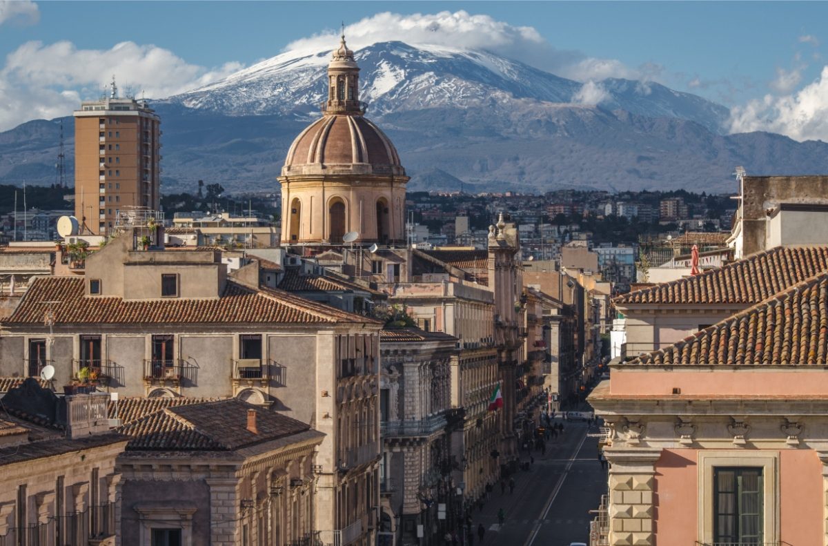 Panoramic view of the Dome of Catania at via Etnea and the Mount Etna in the background