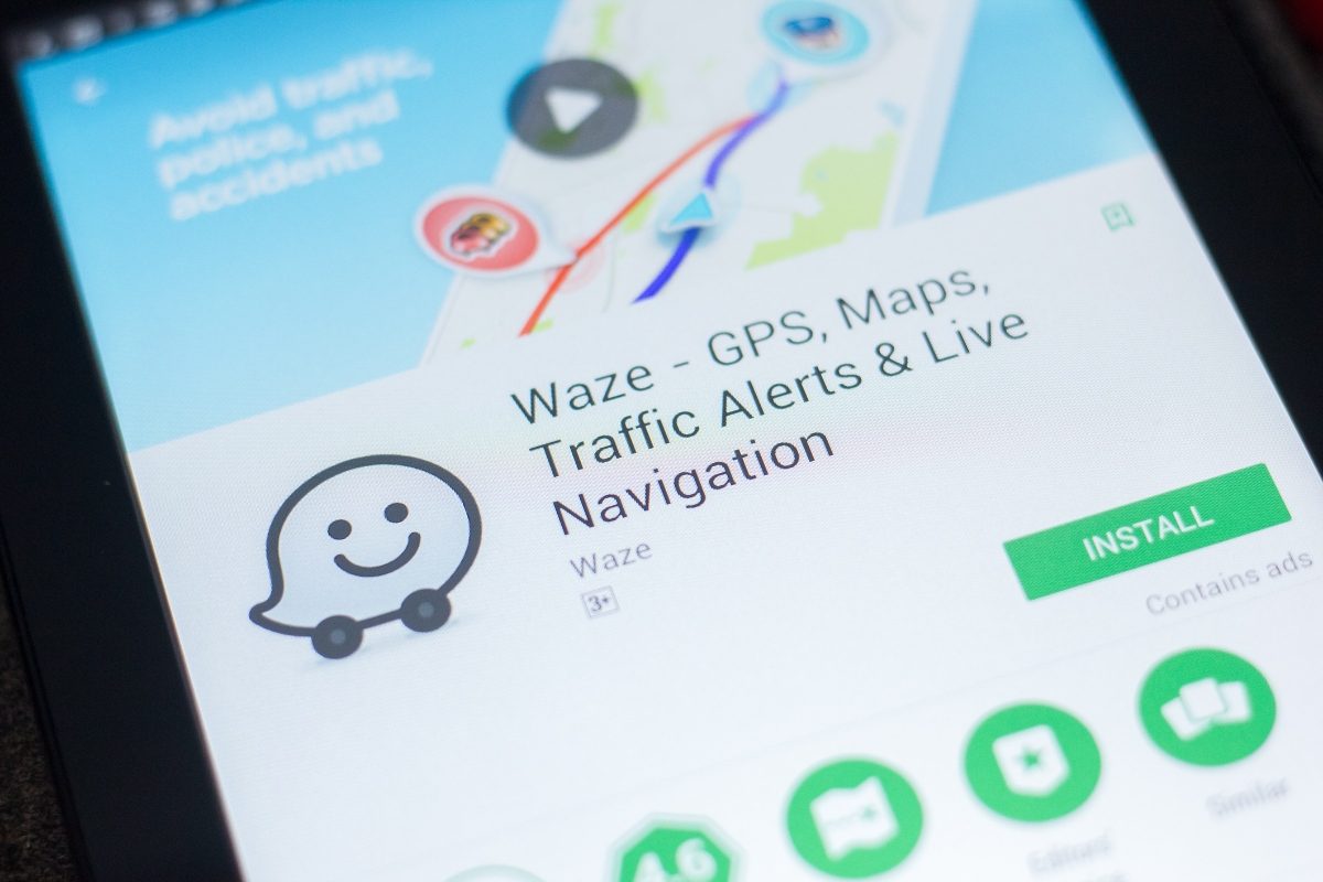 Close-up of a phone screen showing the Waze navigation map application