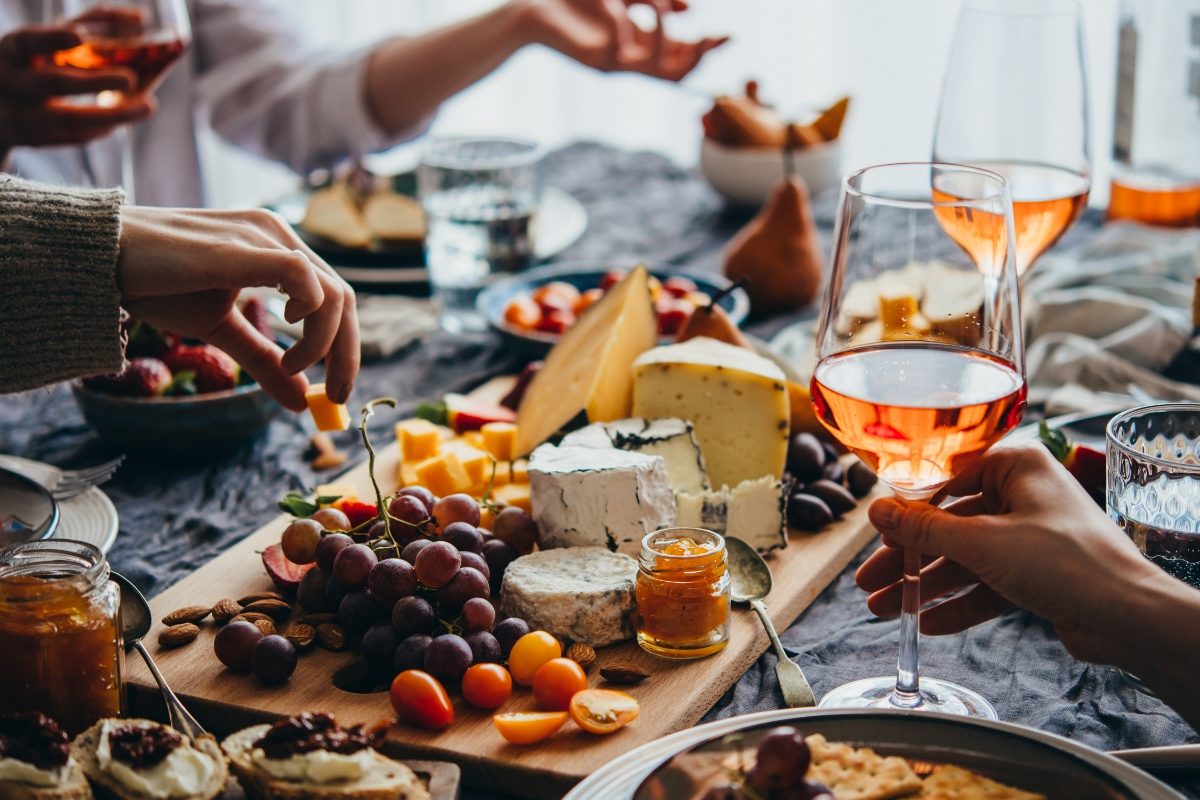 Group enjoying wine and a charcuterie board